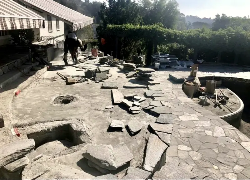 Flagstone cut and dry-fit across the deck before it is set